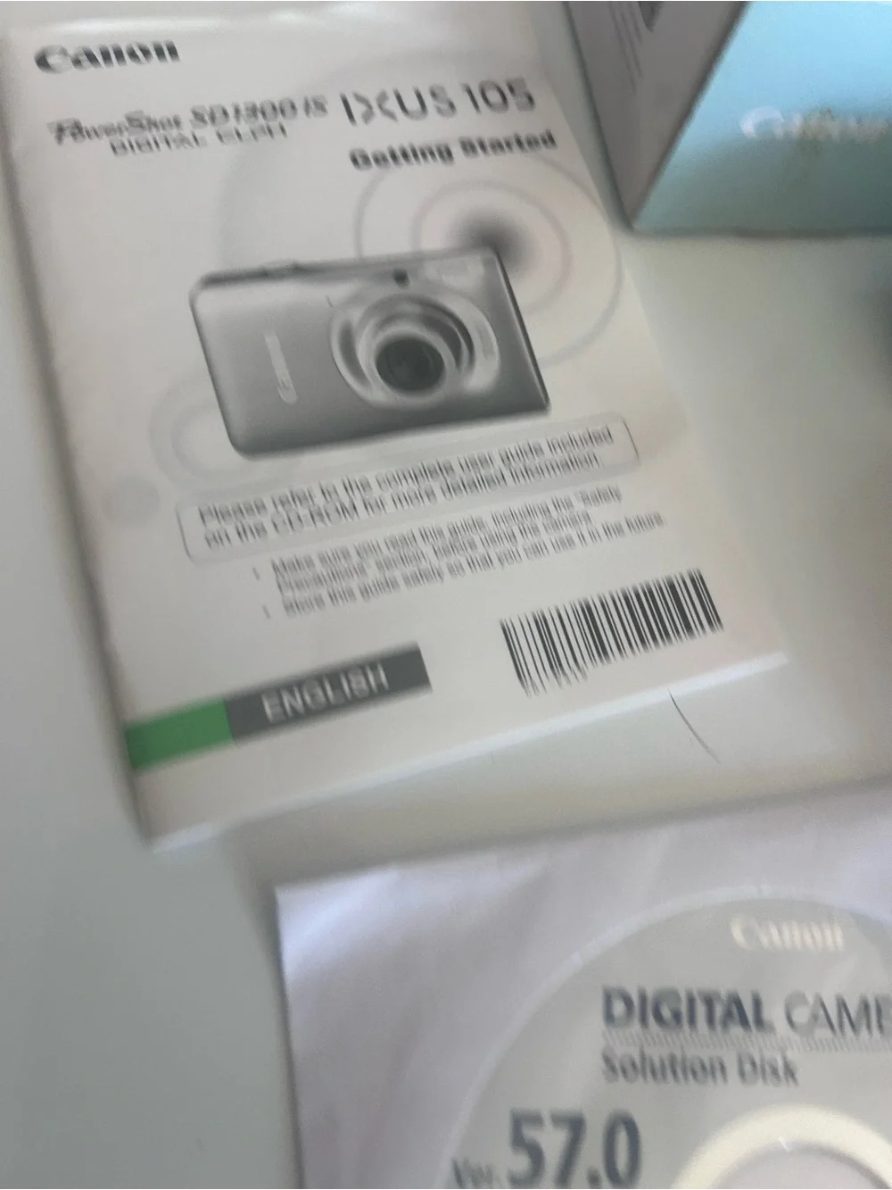 Canon Digital ELPH SD1300 IS 12.1MP Camera - W/ Charger, Software 2 Batteries